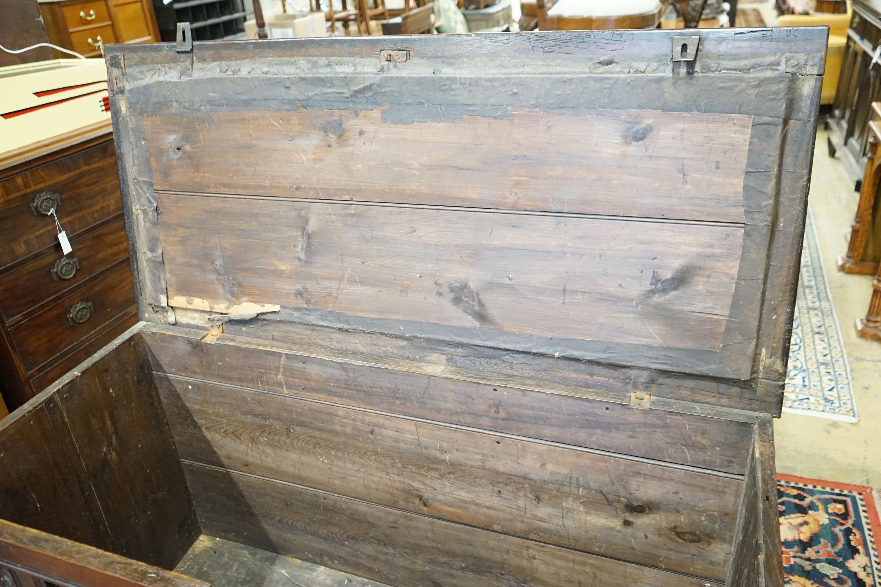 An 18th century panelled oak coffer, length 147cm, depth 67cm, height 80cm